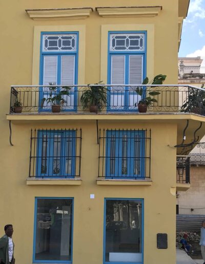 Building with blue shudders in Havana, Cuba