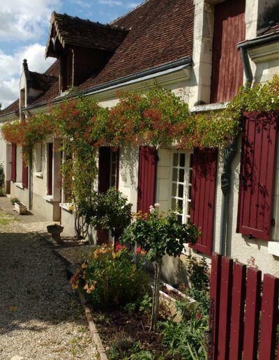 Home Gardens with flowers around walls and doors in Loire Valley, France