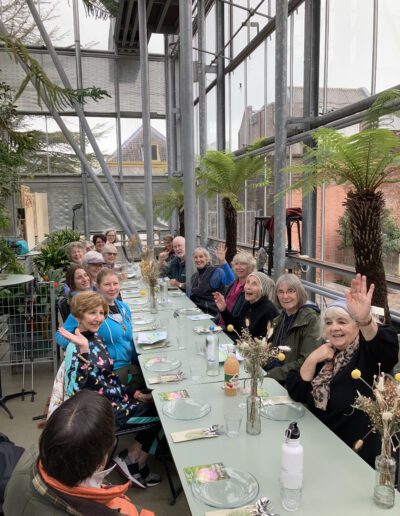 Garden travelers having lunch in a greenhouse